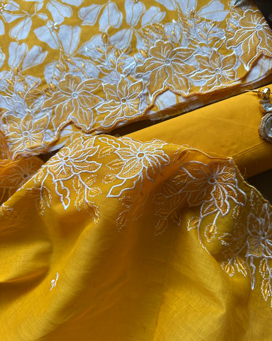 Bright yellow pure cotton suit with cutowork embroidered dupatta and ends