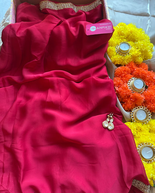 Stone border chinnon plain saree with hand embroidered blouse