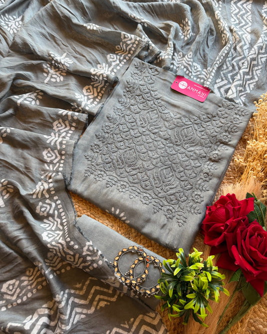 Muslin printed suit with chikan work neck and highlights dupatta
