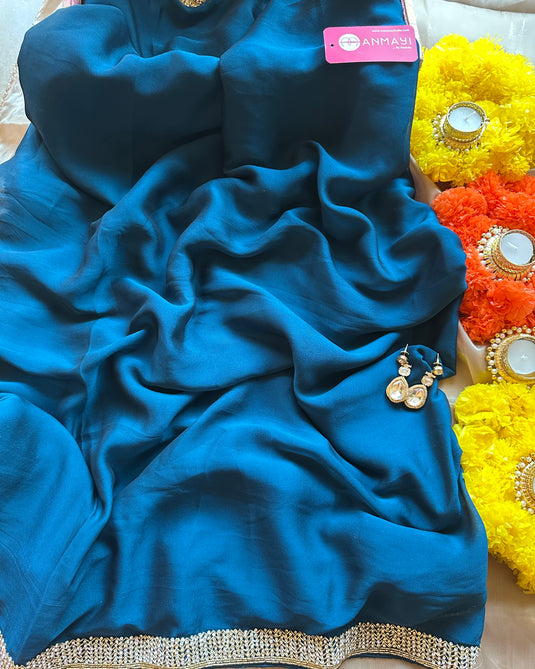 Stone border chinnon plain saree with hand embroidered blouse