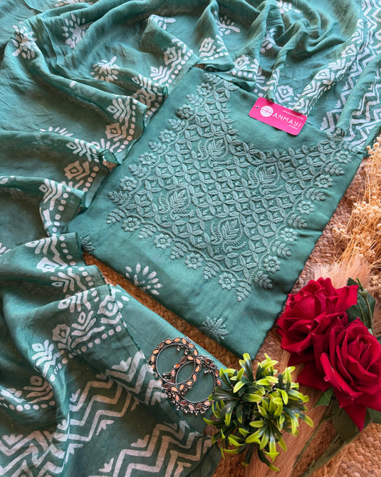Muslin printed suit with chikan work neck and highlights dupatta