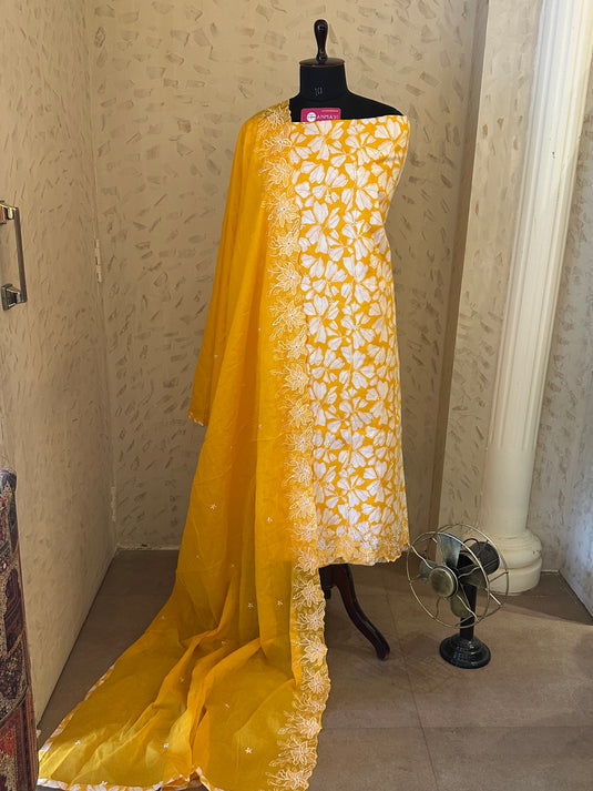 Bright yellow pure cotton suit with cutowork embroidered dupatta and ends