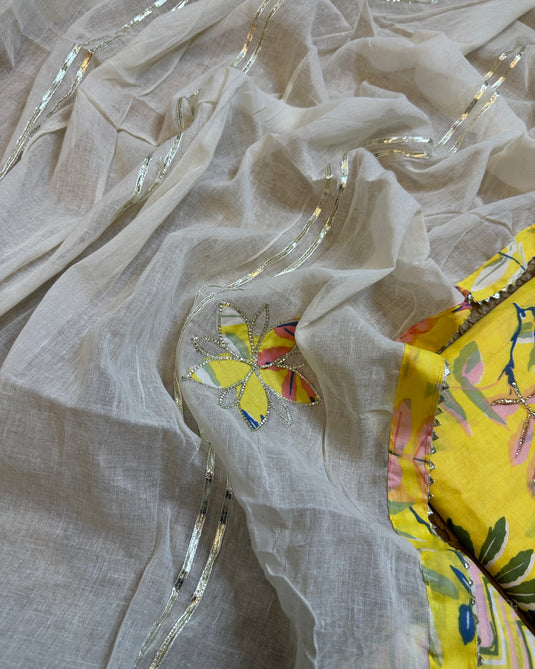 Yellow leafy print cambric cotton suit with gotta patched dupatta