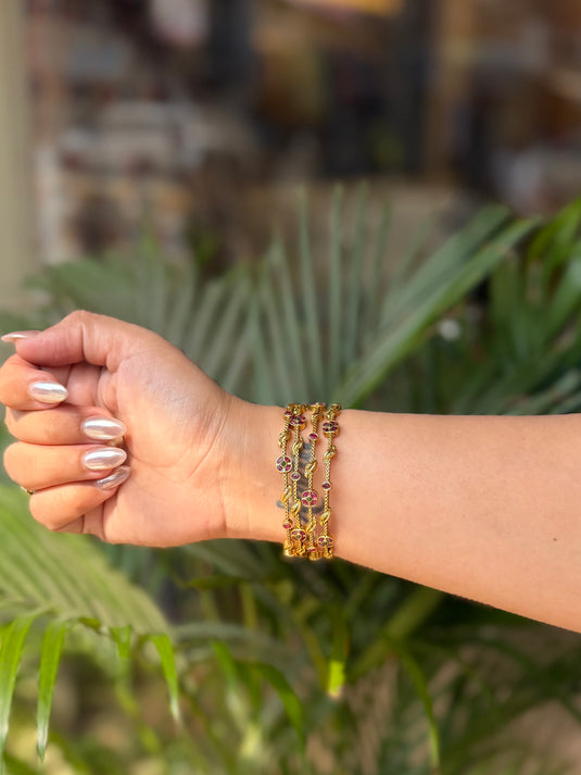 Naari pair of 4 gold rose bangles