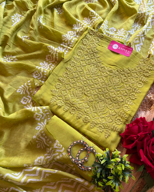 Muslin printed suit with chikan work neck and highlights dupatta