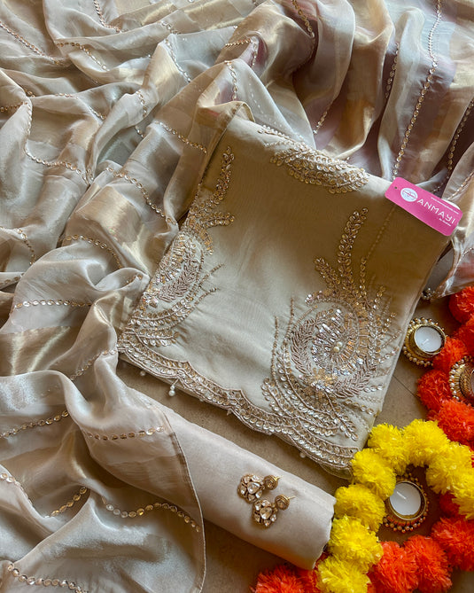 Shimmer gold hand embroidered suit set with shaded dupatta and embellished lines