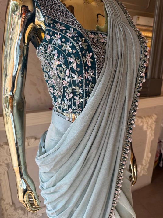 Kridha sage green drape saree with embellished ready to wear blouse