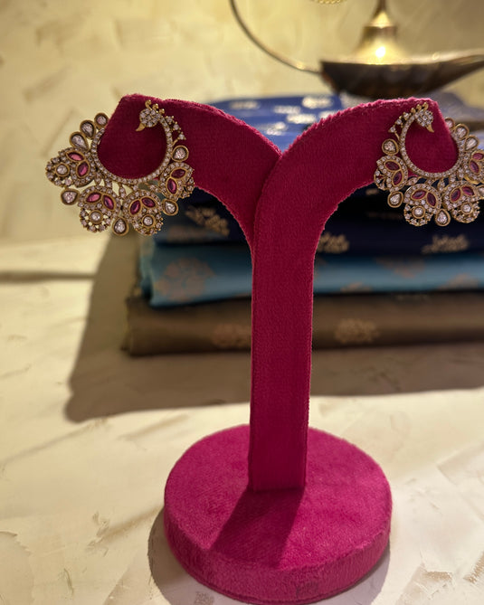 Peacock feather twirl earrings
