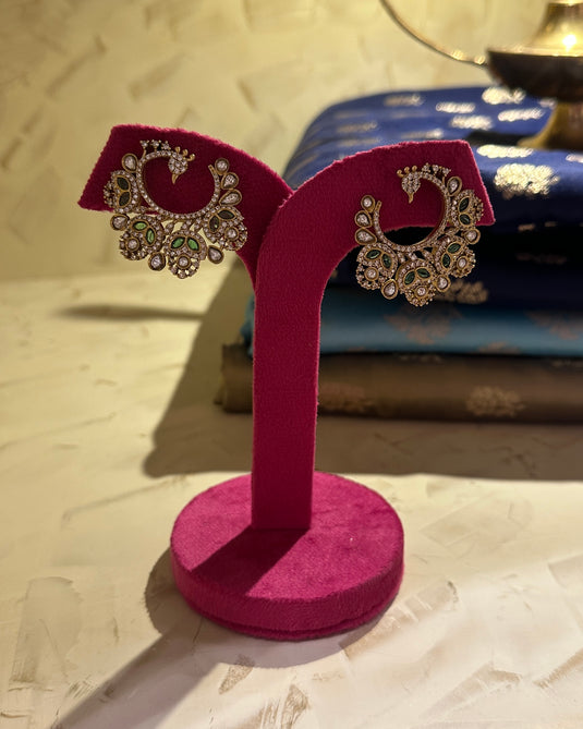 Peacock feather twirl earrings