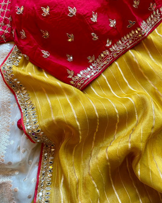 Stripes yellow mirror work georgette saree with embroidered raw silk blouse