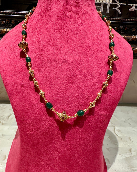 South Indian pearl string with ruby and emeralds