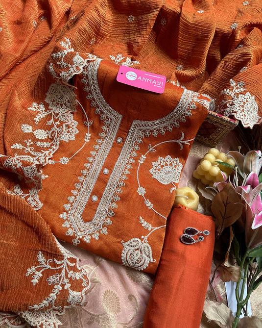 Pure tissue rusty orange suit with aari work and crushed dupatta