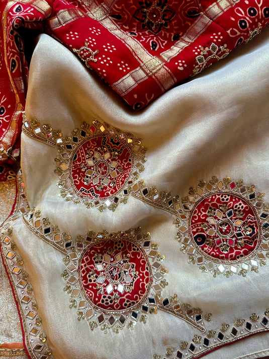 Shimmer ivory mirror work saree with red gharchola embroidered blouse