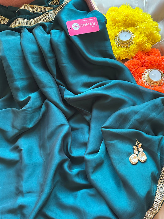 Stone border chinnon plain saree with hand embroidered blouse